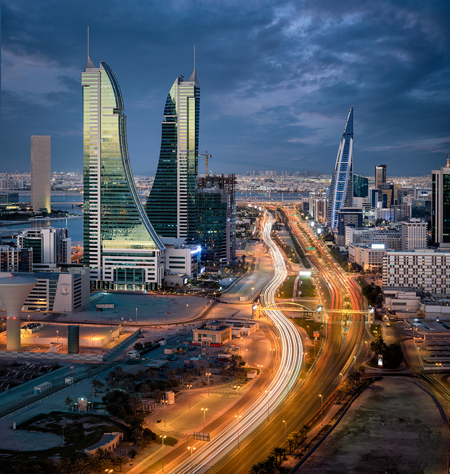 Manama, Bahrain - November 09, 2020: Aerial view of Manama skyline with iconic Bahrain Financial Harbour and Bahrain World Trade Center building during blue hour.